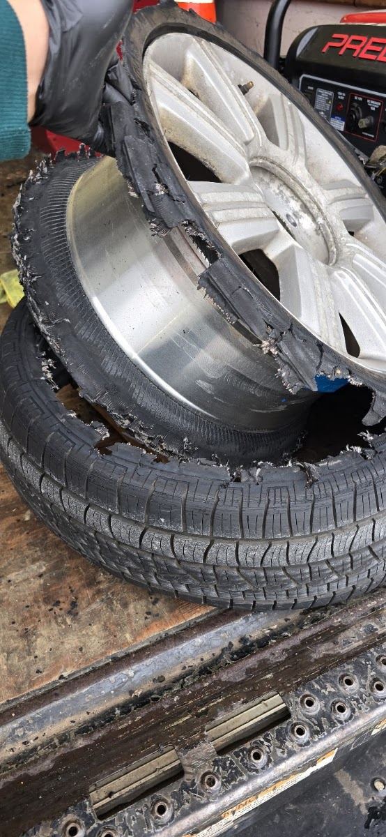 Blown-out tire replaced by Marlon